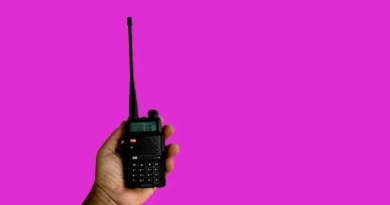 vecteezy_a-portable-radio-transmitter-holding-in-hand-blurred-an_13945584