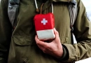 What are the essentials for a first aid kit? vecteezy_a-tourist-person-holds-in-his-hand-a-first-aid-kit-a-red_40506636