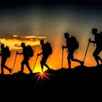 vecteezy_ai-generated-silhouette-of-hikers-trekking-in-mountains_36777838