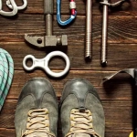 vecteezy_climbing-equipment-on-dark-wooden-background-top-view_3514643