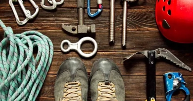 vecteezy_climbing-equipment-on-dark-wooden-background-top-view_3514643