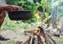 What are the four main priorities for survival? vecteezy_close-up-man-holds-old-black-pot-to-cook-on-bonfire_33368347
