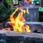 vecteezy_fire-blazes-in-a-homemade-barbecue-grill-in-the-backyard_4548246