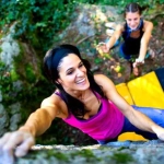 vecteezy_happy-girl-practicing-bouldering-with-the-crash-pad-and-her_11209497