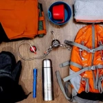 vecteezy_hiking-equipment-backpack-pants-thermos-mittens_40506791