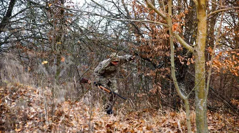 vecteezy_hunter-in-uniform-with-a-hunting-rifle-hunting-concept_43279275