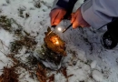vecteezy_making-fire-with-a-fire-starter-in-the-nature-and-winter_40350582