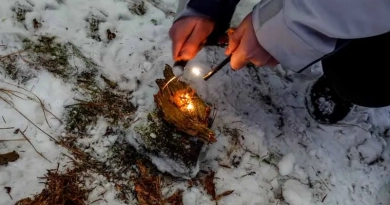 vecteezy_making-fire-with-a-fire-starter-in-the-nature-and-winter_40350582