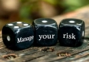 vecteezy_manage-your-risk-three-black-dices-on-a-white-background_46004612