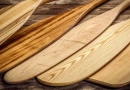 vecteezy_set-of-wooden-canoe-paddles-against-rustic-wood_40693581
