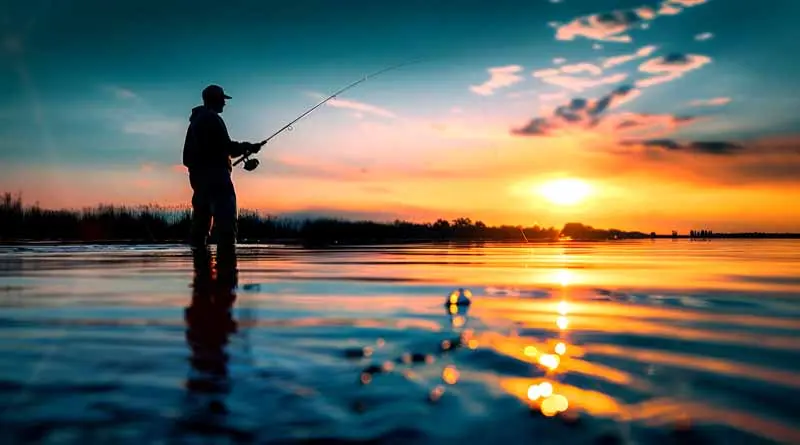 vecteezy_silhouette-of-a-fisherman-at-sunset-casting-a-long-line_44633018