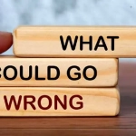 vecteezy_what-could-go-wrong-text-on-wooden-blocks-with-blurred_9948163