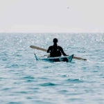 vecteezy_woman-sea-kayak-happy-smiling-woman-in-kayak-on-ocean_45598333