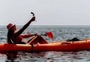 Can I bring a camera or smartphone while kayaking? vecteezy_woman-sea-kayak-happy-smiling-woman-paddling-in-kayak-on_45601353