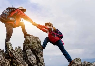 How Do I Improve My Climbing Technique? vecteezy_young-couple-traveling-helping-hand-hiker-woman-getting_8094892