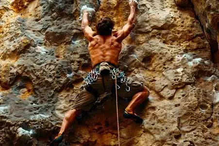 vecteezy_man-climbing-a-rock-wall_47097725