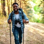 vecteezy_young-man-enjoys-hiking-in-nature_46921140