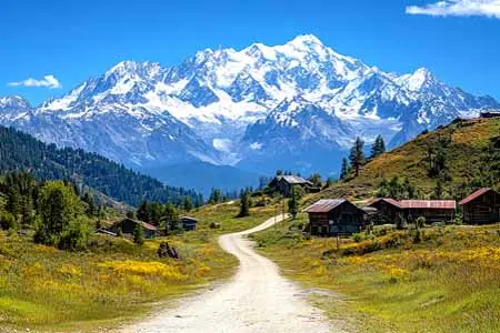 Tour du Mont Blanc France-Italie-Switzerland - vecteezy_dirt-road-leading-to-old-cabins-with-snowcapped-mount_50785086
