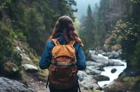 vecteezy_ai-generated-a-lonely-tourist-on-a-mountain-stream considering how to stay safe when hiking in a thunder storm