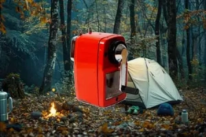 forest-clearing-with-big-white-tent-gear-including-Hand Cranked Charger
