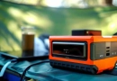 How Do I Keep My Electronics Charged While Camping? A portable power generator providing power at a campsite